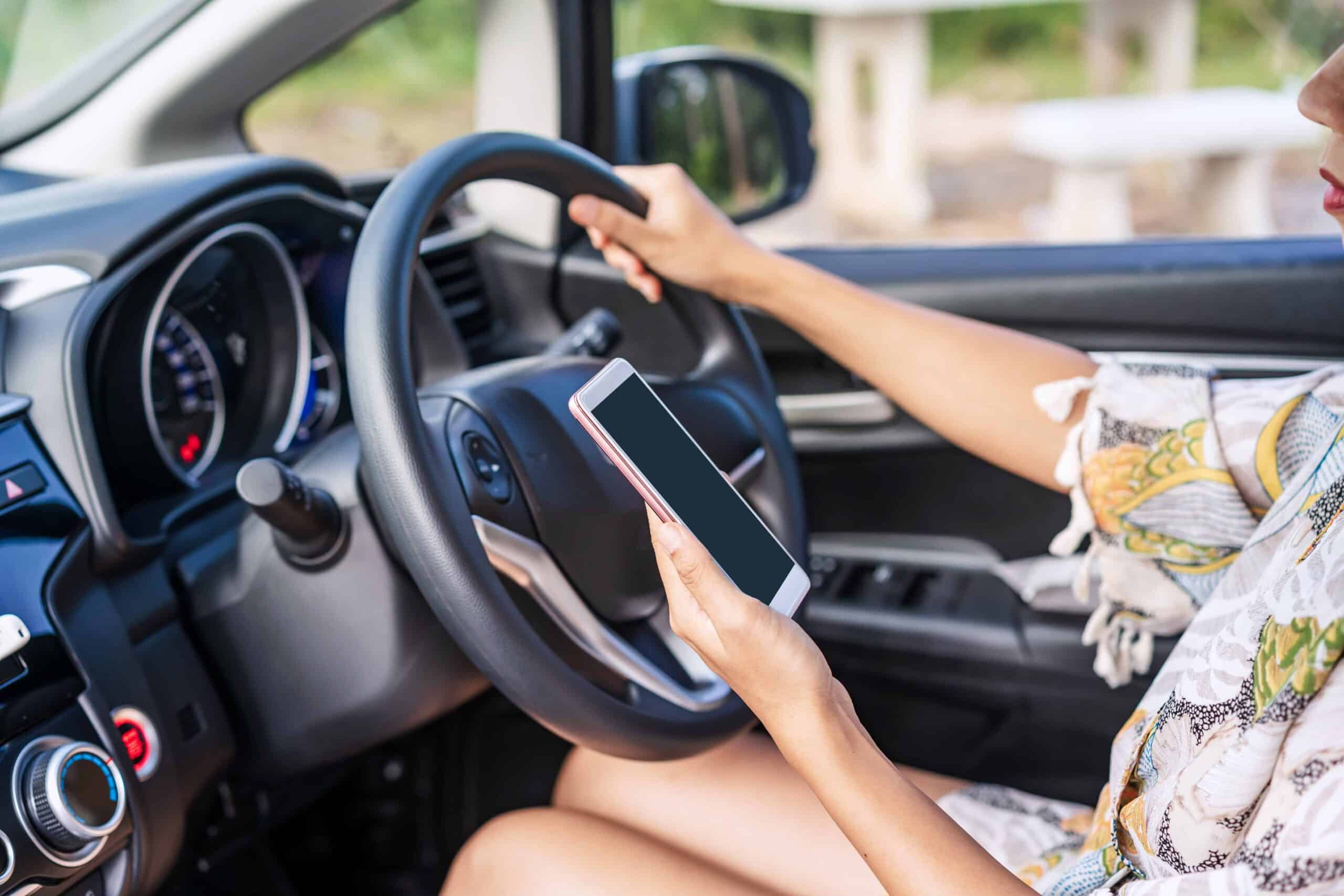 Woman driving distracted